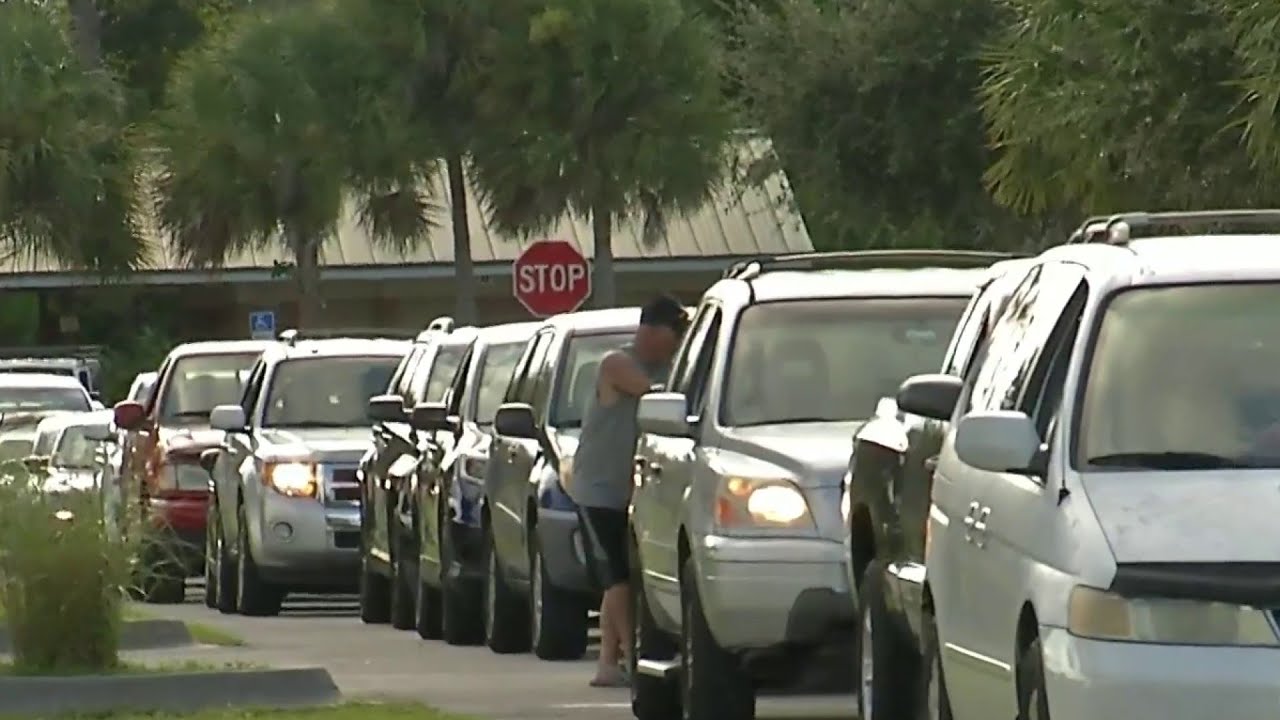 newspaper mockup People wait in line for hours for sandbags to prepare for Dorian