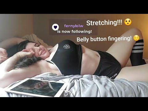 Aikobliss stretching and playing with her belly button!