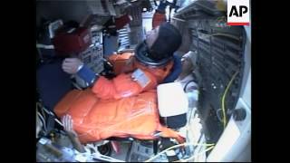 Astronauts put their suits on ahead of launch