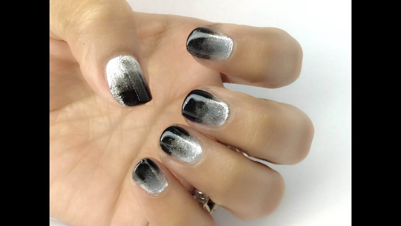 4. "Gothic Black and Silver Nail Design with Skull Accents" - wide 1