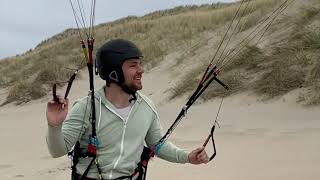 Progression as a kitesurfer soaring in the dunes with paraglider