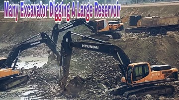 Power of Heavy Machinery: Excavators Digging a Giant Reservoir