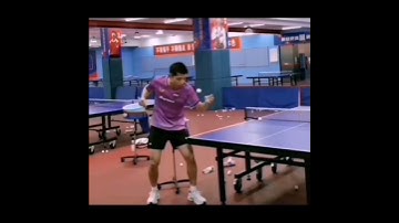 Zhang Jike practice his serve