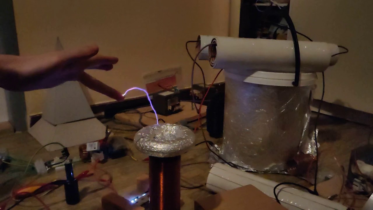Tesla coil and touching to arcs YouTube
