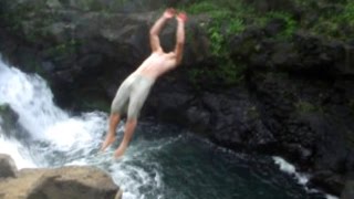 Waterfall cliff jumping in Hawaii