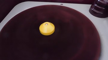 Webcor 3 speed manual portable record player playing a 45 RPM record.