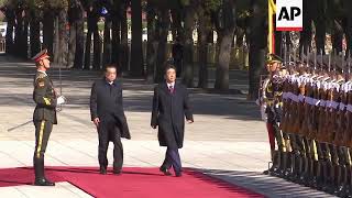 Japan's Abe welcomed by China's Li with honour guard ceremony in Beijing