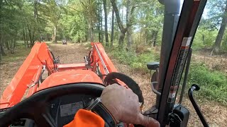 Kubota M6-111 spraying chemicals at Magby property