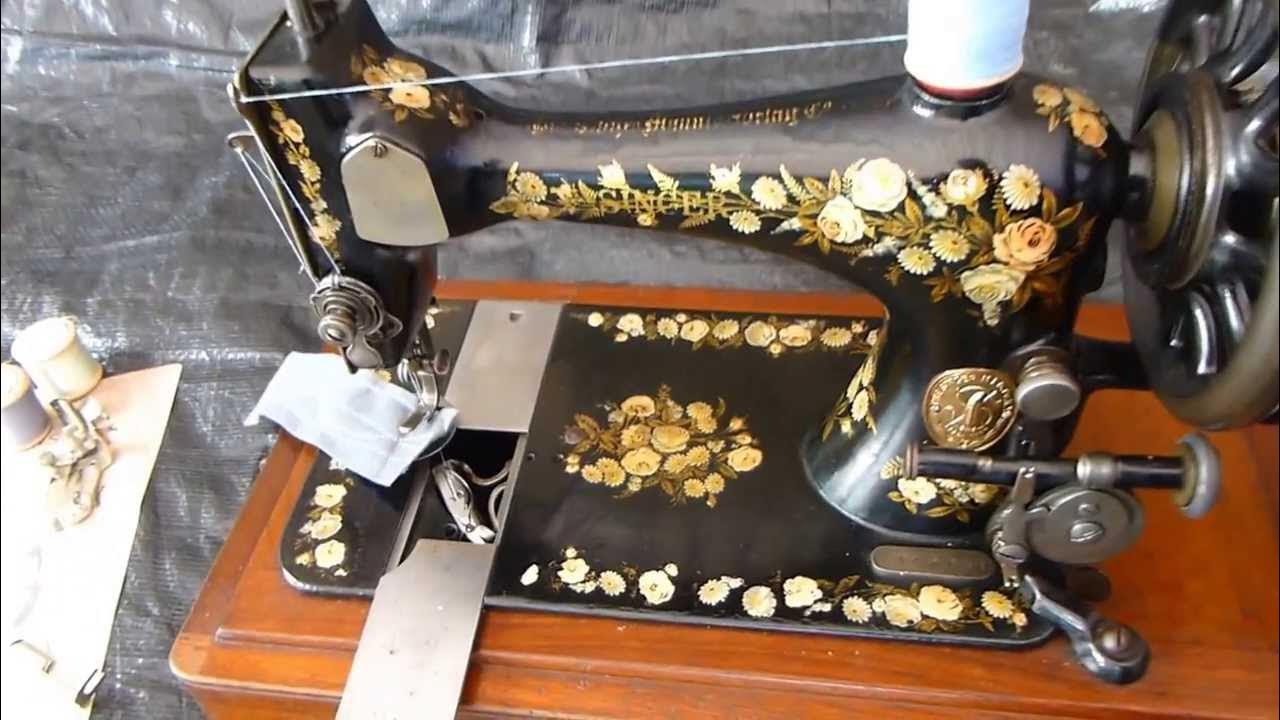 Alex Askaroff demonstrating the vibrating shuttle sewing machine of