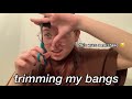 trimming my bangs bc i need to