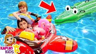 Summer vacation & Kids' activities at the swimming pool. Inflatable toys for baby and mom.