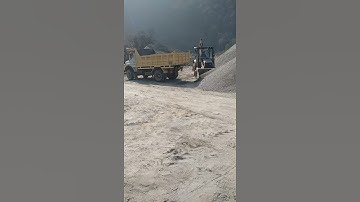 Loading aggregate in Tipper Trucks from Stone Crusher Plant