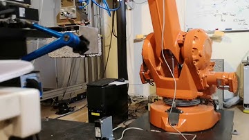 Lifting a block with an ABB IRB2400 robot without calibration