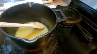 Home made salted caramel sauce in cast iron pan