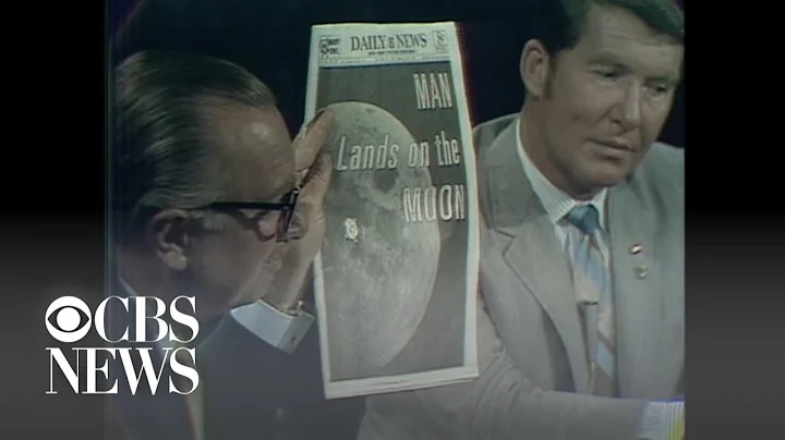 Walter Cronkite shows front-page headlines about moon landing