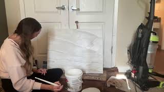 Sanding the modeling paste and gesso layer.