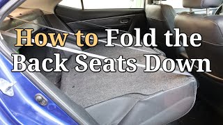 How to Fold the Back Seats Down on a Toyota Corolla How to Fold the Back Seats Down on a Toyota Corolla