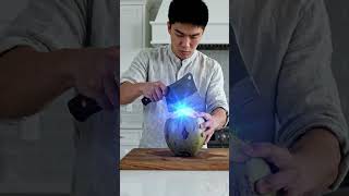 A man slice the blue coconut.