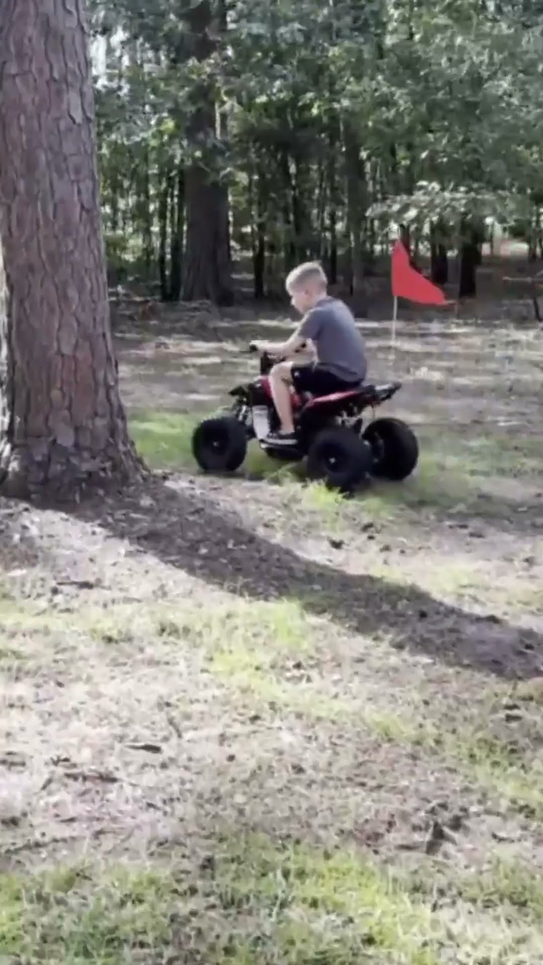 FRP Sahara 40 kids ATV being ridden on a dirt trail