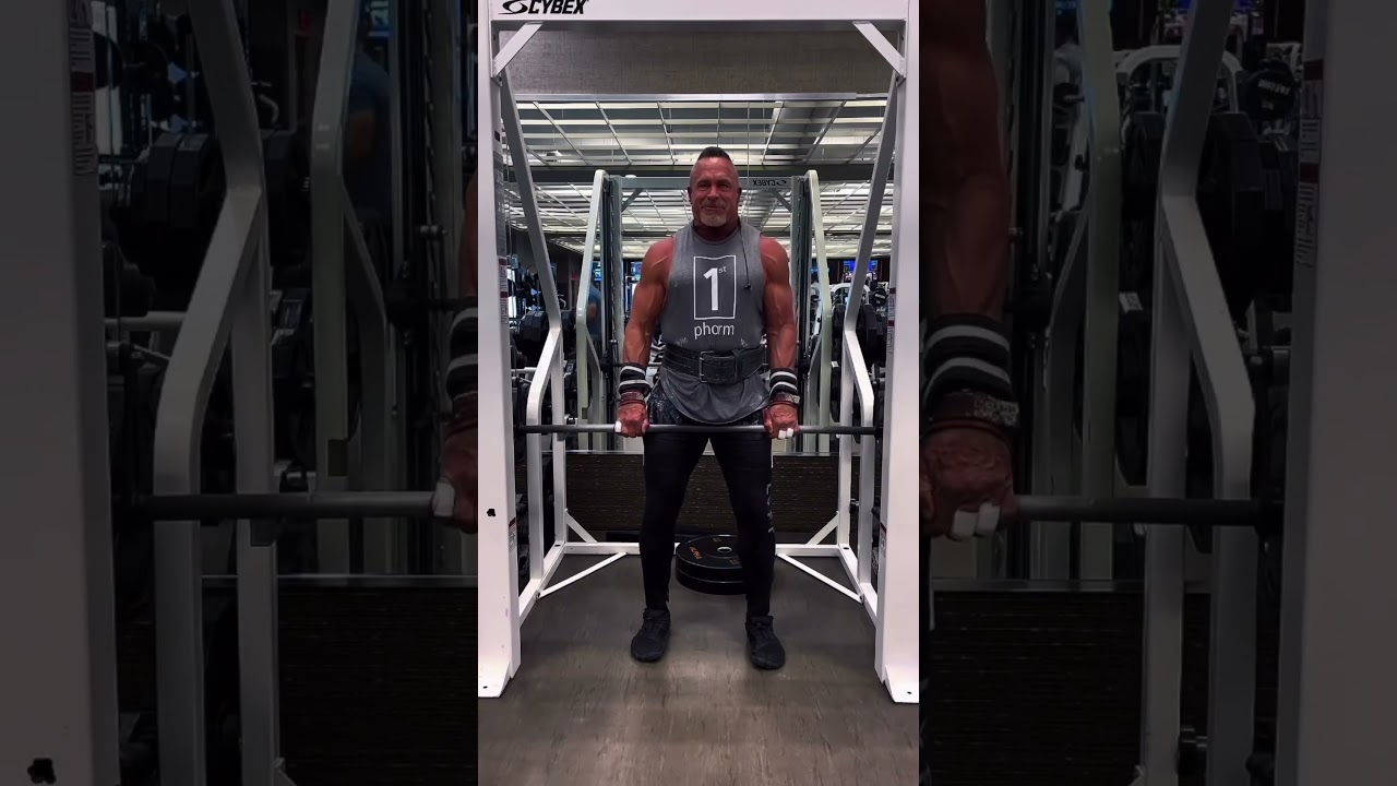 The Smith machine is a great place to safely go heavy with your shrugs. #shrugs #smithmachine
