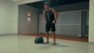 Lateral Burpees Over Backpack