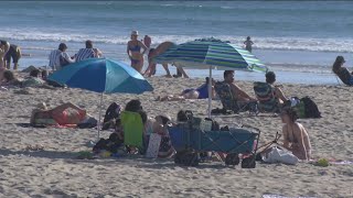 Travelers, San Diegans flock to the beach to celebrate St. Patrick's Day