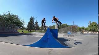 Guys Do A Duo Backflip Jump On Bmx Ramp