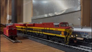 KCS M263 with a Grey Ghost GP40-2 trailing on the layout.