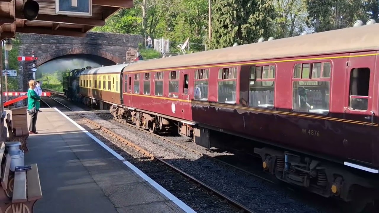 Lady of Legend pulls out of Bishop's Lydeard with the empty stock for Minehead.