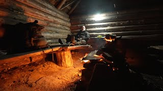 emergency overnight in ruins of an abandoned log cabin , bushcraft