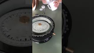 Replace liquid and dispose the bubble of magnetic compass