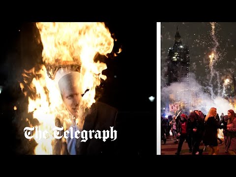 Eight officers injured as protesters burn Boris Johnson effigy and launch fireworks at police