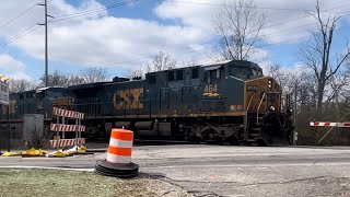 CSX freight train with some freshly painted hoppers at N Post Road