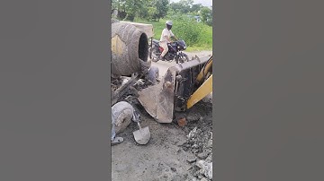 A mixer machine is pouring concrete into the bucket of a backhoe loader.#terex #mixermachine #jcb