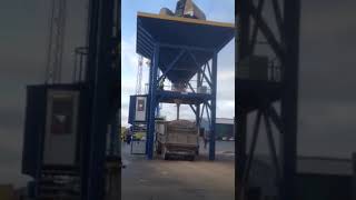 Loading Wood Pellets into a Truck with Dust Suppression Hopper