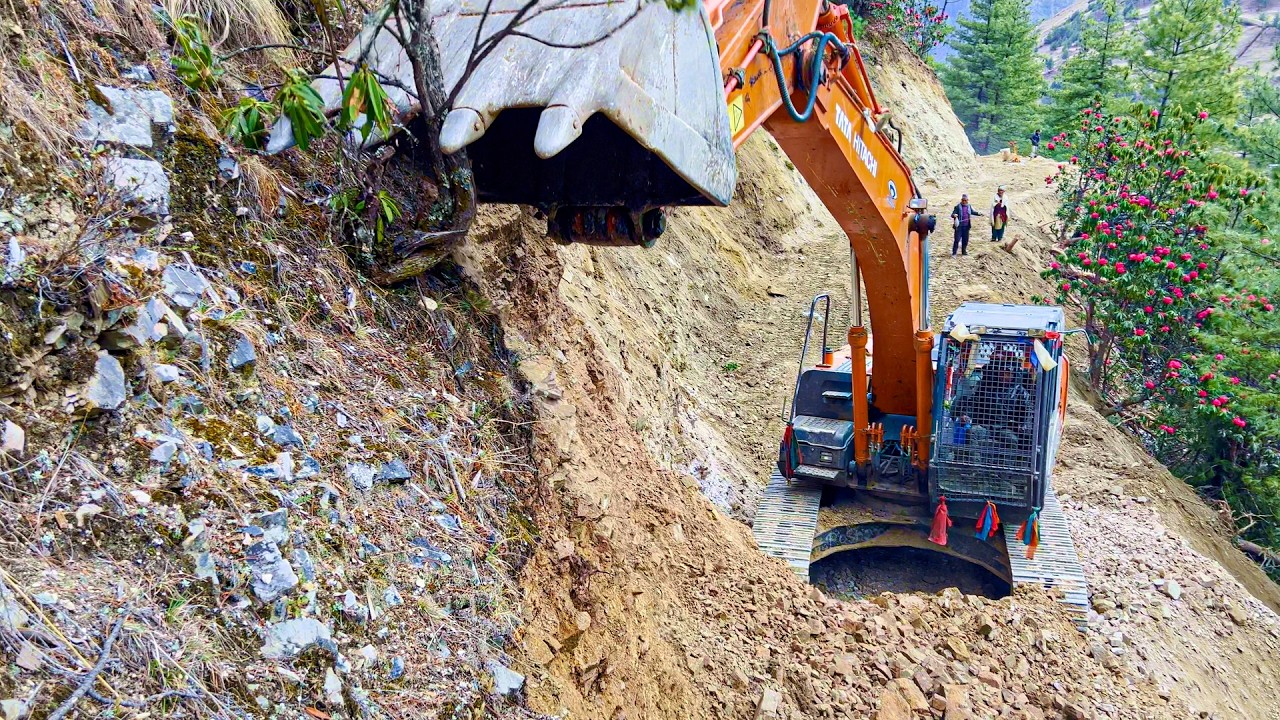 Excavator Backhoe Carving Rocky Mountain Beside Blooming Rhododendrons 🌺 Villagers Watching.