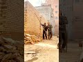 Strategic Manual Demolition of a Large Brick Wall Structure