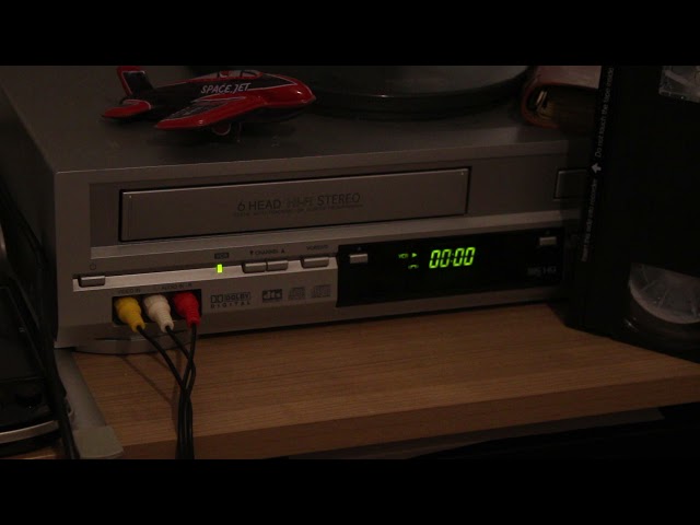 Free Stock Video - Inserting a VHS cassette into a VCR - Best Stock Footage class=