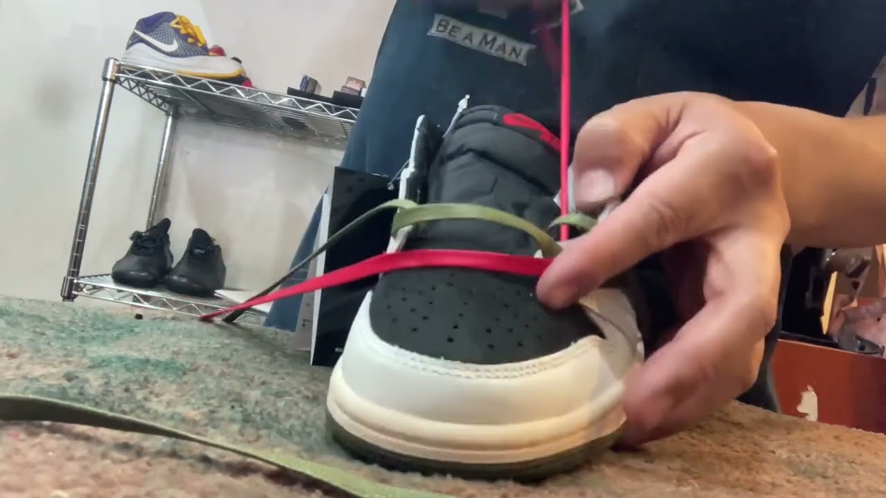 The shoe shiner owner double-knots his sneaker laces! He realizes