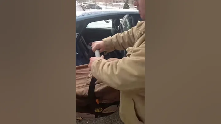 Joshua Chaney putting his baby boy in the car for ...