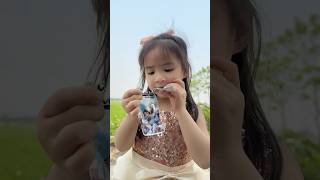 The Good Little Girl Enjoys Rock Candy And Chocolate Pebble Candy Deliciously.