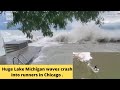 Huge Lake  Michigan waves crash into runners in Chicago .