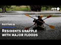 Australian residents grapple with flood damages | AFP