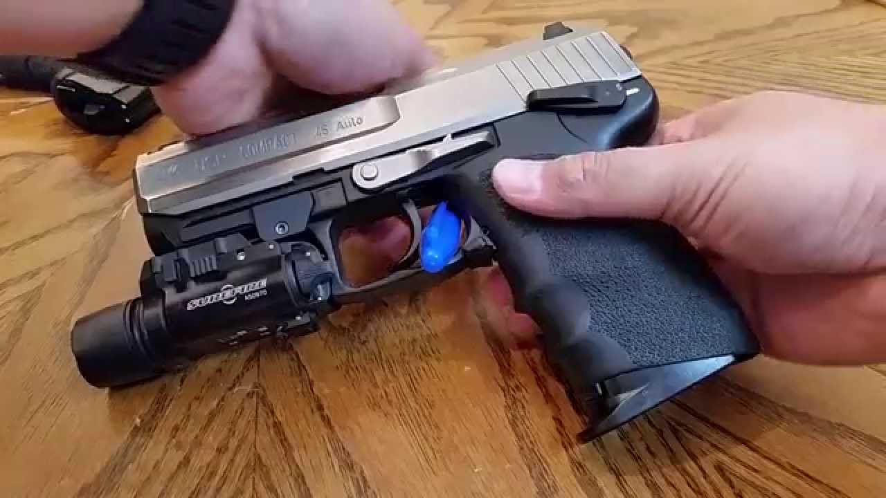 Installation of an extended magazine release on a HK USP 45 Compact. 