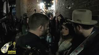 Sierra Ferrell plays a song for her fans in the alley.