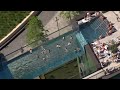 Pool Suspended Between High Rise Buildings Opens for Summer