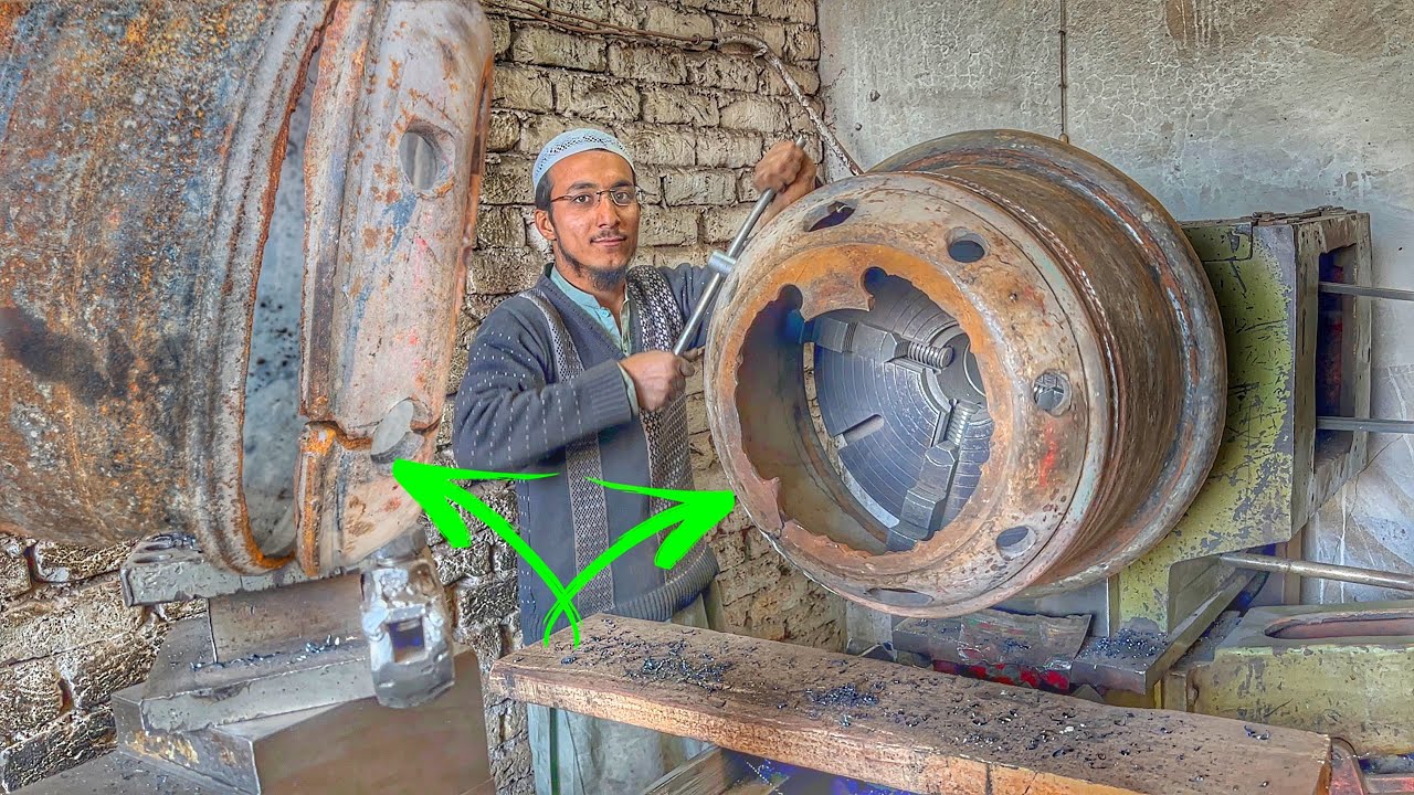 Junior mechanic tackles a broken truck rim in his auto repair class ...