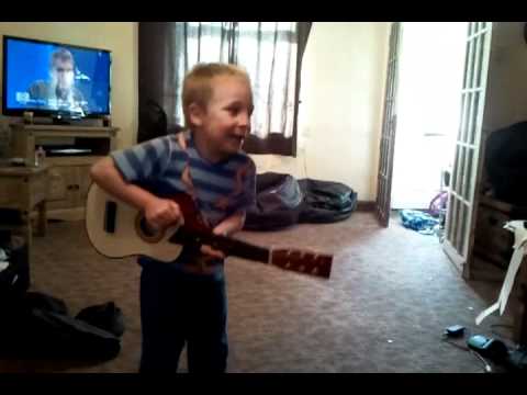 5 year old playing guitar and singing - YouTube