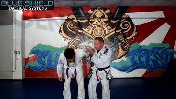 Shoulder to arm bar takedown