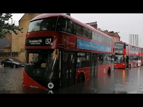 Cars and buses stuck as London roads flood in storm